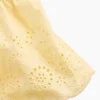 Blusa con dobladillo de ojales para bebés y niños pequeños