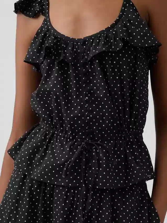 Blusa con mangas onduladas y lazo en la cintura