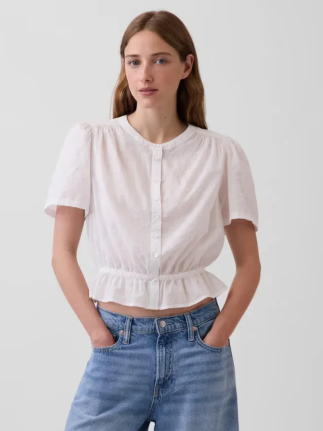 Blusa corta con peplum y cierre frontal de botones