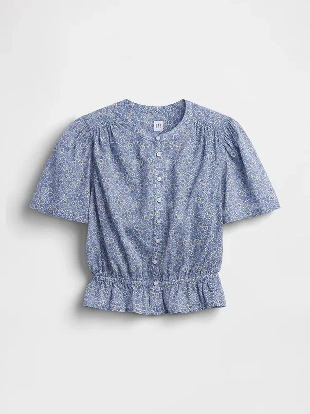 Blusa corta con peplum y cierre frontal de botones