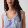 Blusa corta con peplum y lazo frontal con ojales