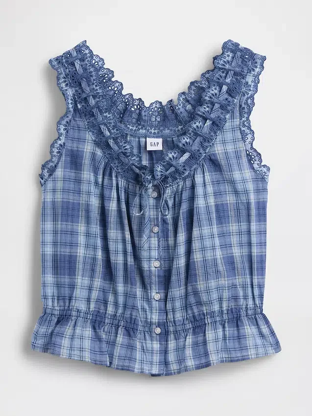 Blusa corta con peplum y lazo frontal con ojales