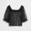 Blusa de tul transparente con bordados
