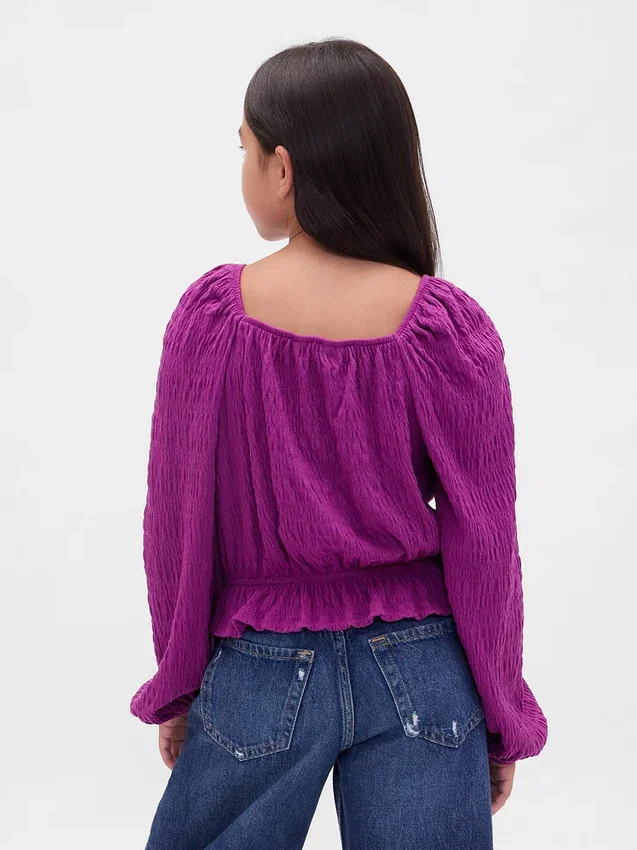 Blusa infantil con peplum arrugado