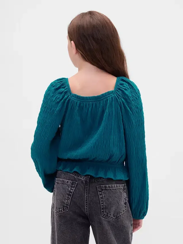 Blusa infantil con peplum arrugado