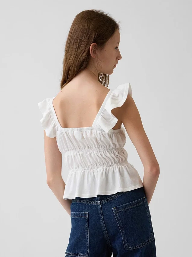 Blusa infantil con peplum, mangas con volantes y fruncido