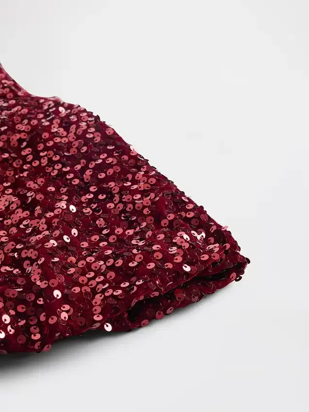 Blusa infantil con volantes y lentejuelas