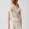 Blusa infantil de gasa de algodón con peplum fruncido