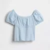 Blusa infantil de mangas abullonadas con ribete de encaje