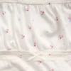 Blusa infantil de mangas abullonadas con ribete de encaje