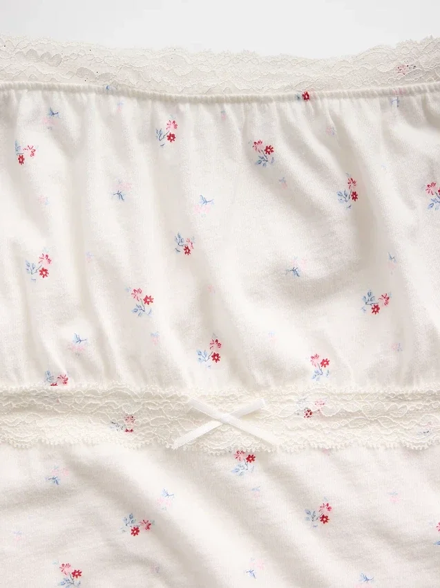Blusa infantil de mangas abullonadas con ribete de encaje