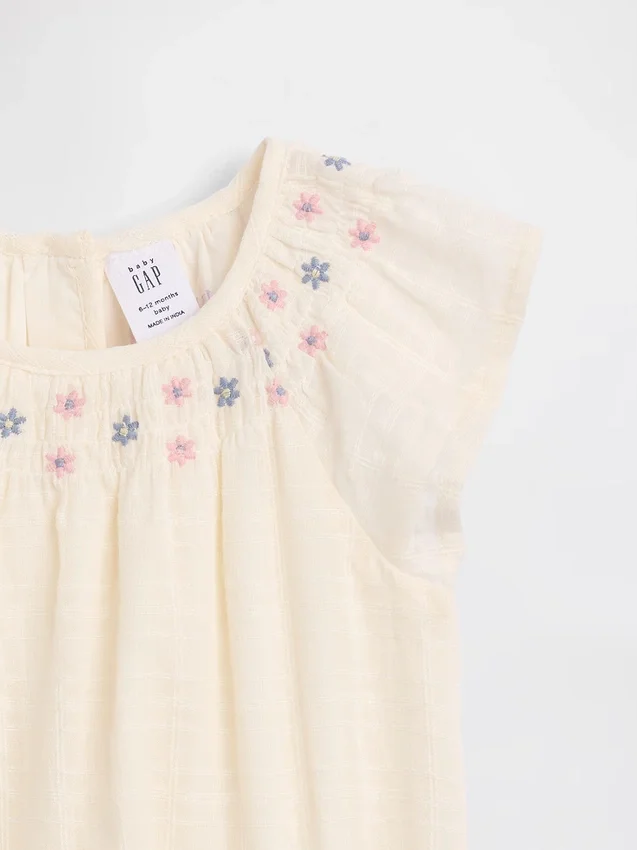 Body floral con fruncidos para bebé