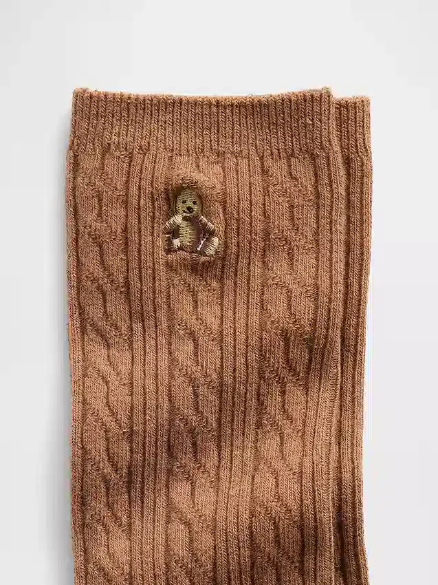 Calcetines de cuello alto con tejido trenzado y el oso Brannan