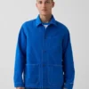 Consigue la chaqueta de trabajo holgada azul