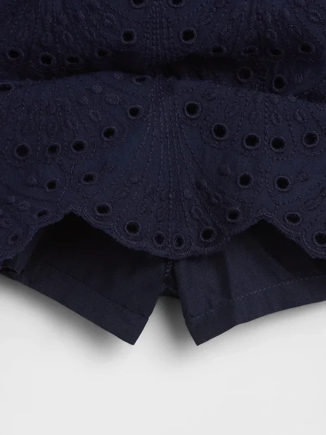 Faldita-pantalón mini con ojales