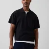Jerséu polo oversize con bolsillo y cremallera de un cuarto