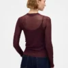 Jerséu transparente de cuello alto