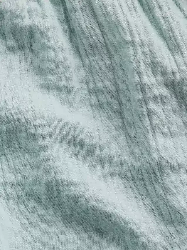 Pantalones cortos de gasa de algodón para niños con dobladillo de mariposa