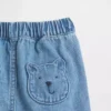 Pantalones cortos de mezclilla para bebé con bolsillos y el oso Brannan