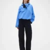 Pantalones plisados de talle alto con corte en arco de GAP × Victoria Beckham