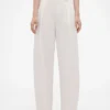 Pantalones plisados de talle alto con corte en arco de GAP × Victoria Beckham