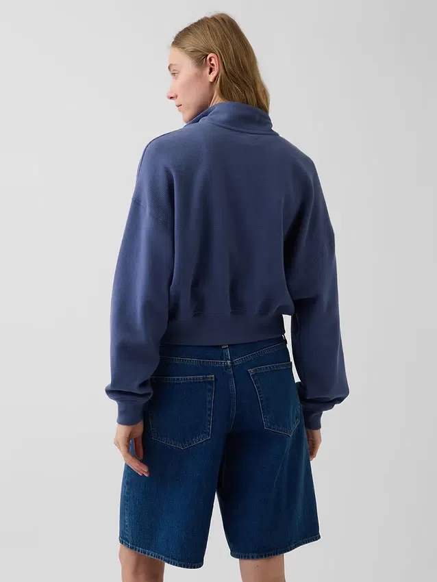 Suéter oversize de algodón texturizado con media cremallera