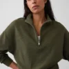 Suéter oversize de algodón texturizado con media cremallera