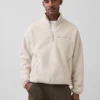 Suéter oversize de sherpa con media cremallera