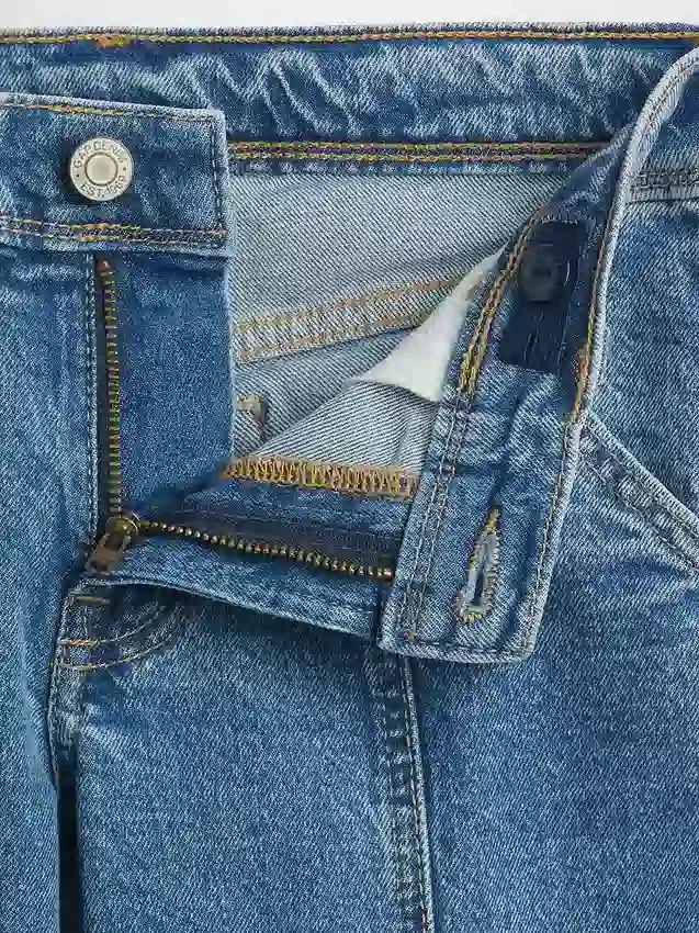 Vaqueros de mezclilla para niños de talle bajo, con costuras y corte acampanado holgado