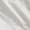 Vestido infantil con ojales