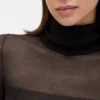 Vestido largo de jerséu transparente con cuello alto